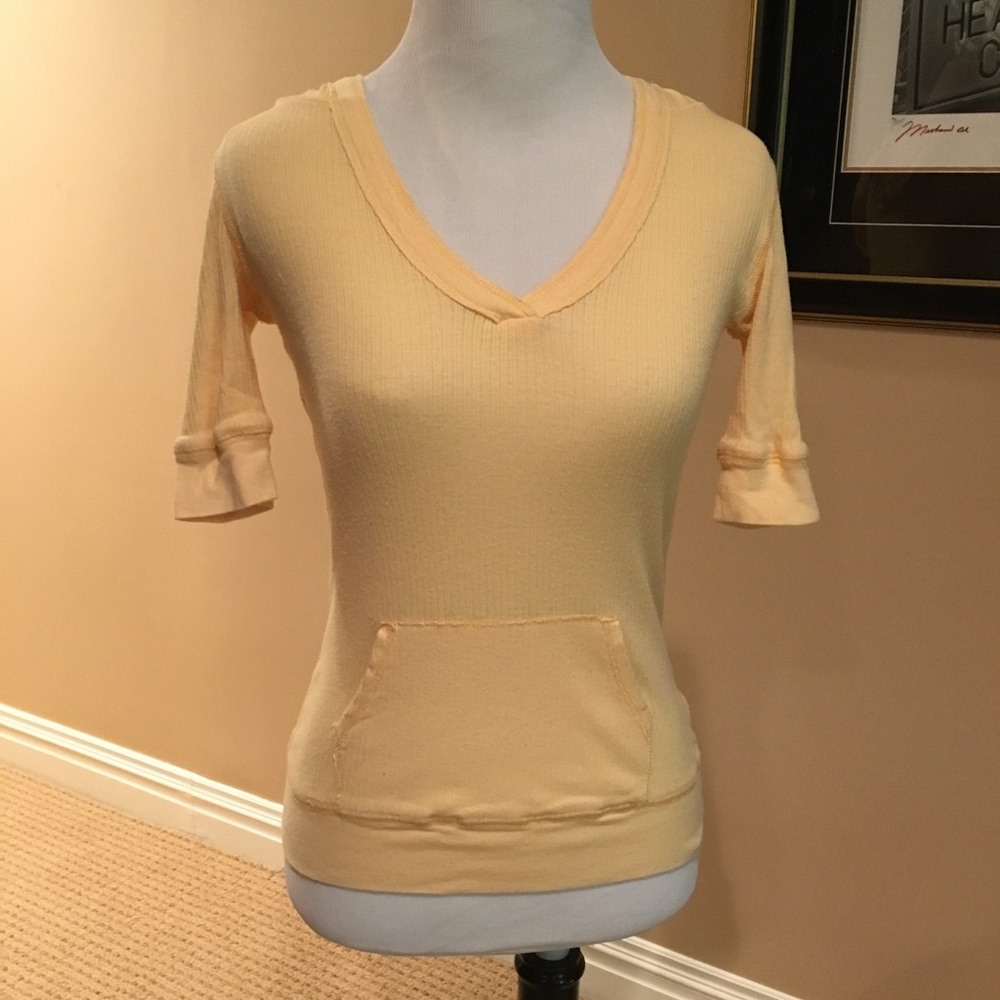 Fitted yellow v neck top w/hood and pocket.